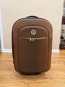 small brown rolling suitcase
