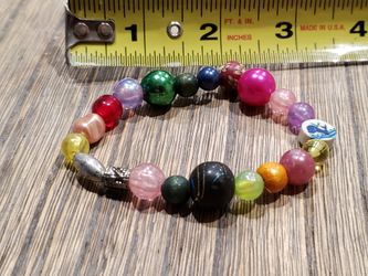 Bracelet. Multi colored bracelet with multiple charms.