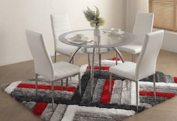 White dining set, great price. Includes 4 chairs and a round white table. Inquire for price.