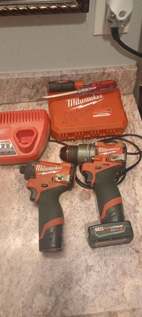 Milwaukee M12 Impacts With Battery And Charger