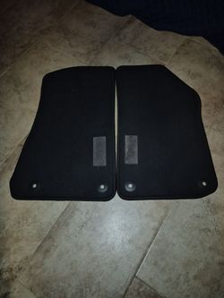 genuine Mopar carpet floor mats for a 4-door Jeep Wrangler JL (part number 6BR85TX7AB).