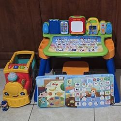 VTech Explore & Write Activity Desk
/ Fisher-Price Little People Big ABC Animal Train, Push-Along Toy Vehicle with Lights, Music and Smart Stages Lear