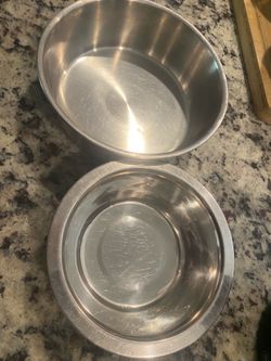 Pet food and water bowls sold together