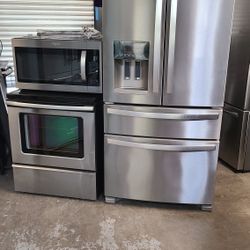 Refrigerator Whirlpool 4 Door French Door,  Stove Electric And Microwave In Stainless Steel Combo Delevery 