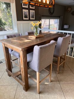 Counter height dining table and bar stools