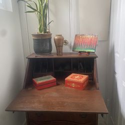 Antique secretary desk has an abundance of charm and history. I get compliments all the time in my house. It has has a lot of storage for small size. 