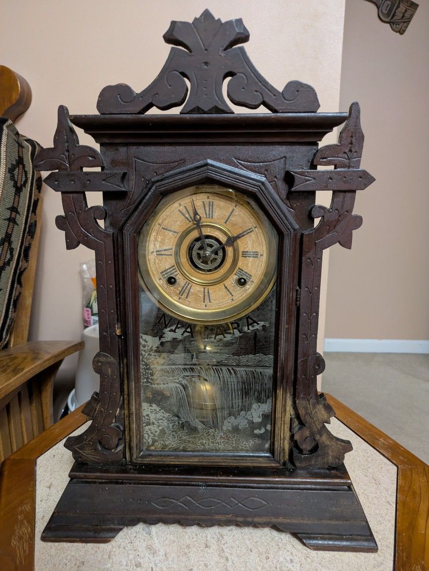 Antique Niagara Falls Trademark Mantle Pendulum Clock.  Walnut Wood & Operates.  Has A Half Hour Chime As Well