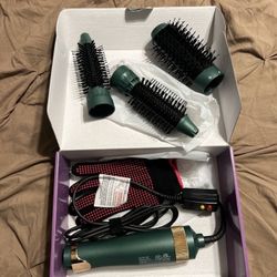 Hot air brush with interchangeable heads