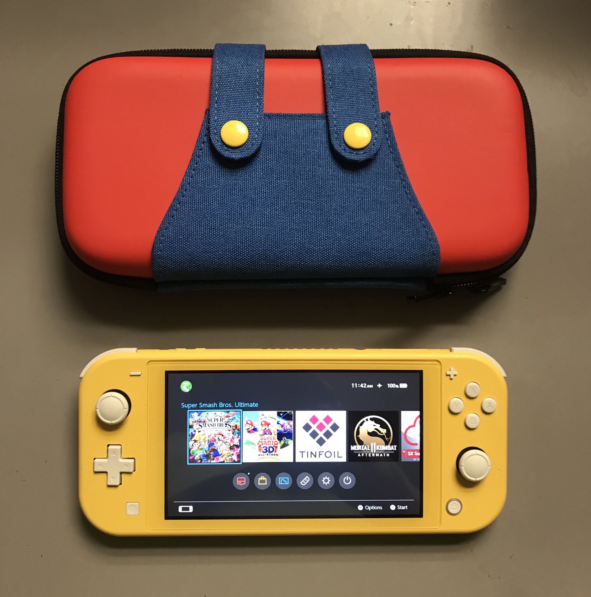 NINTENDO SWITCH LITE with Over5000 Games MARIO KART, MAEIO PARTY, MARIO 3D WORLD, POKEMON, ZELDA and Many More