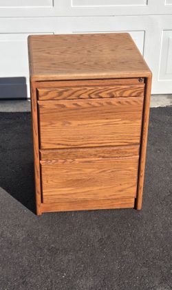 Oak 2 drawer file cabinet. Legal size