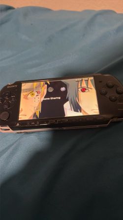 PSP 3000 with 6 games and charger for $70