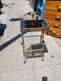 Antique-style  side table, plant stand, magazine rack, rose decoration, mirror.