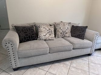 Ashley Furniture Light Gray Sofa & Loveseat Set with Nailhead Trim