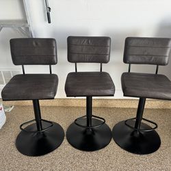 3 Brown Leather Adjustable Bar Stools. Great Condition. $900 Value