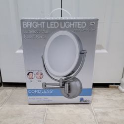 brand new bright led lighted cordless wall mount mirror. (MUST SELL TODAY)