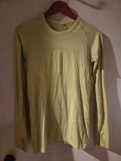 Womens yellow Lululemon shirt, size 8
