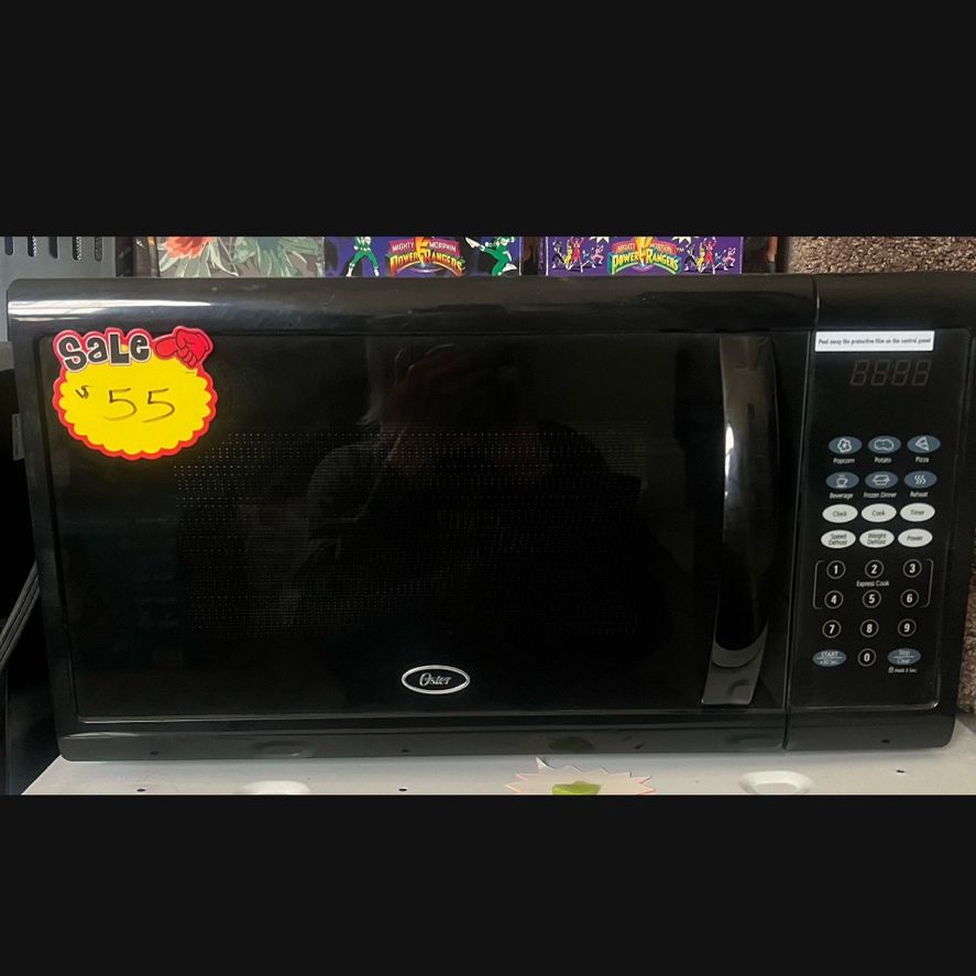 NEW OSTER MICROWAVE 