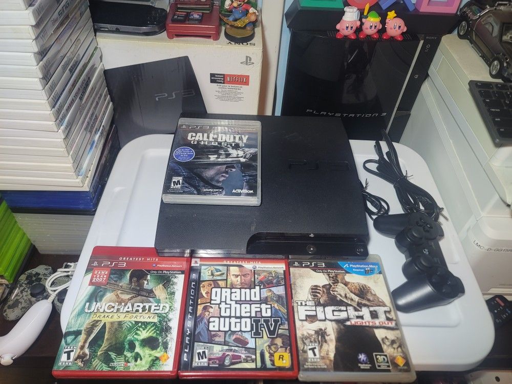PS3 Slim With 4 Games