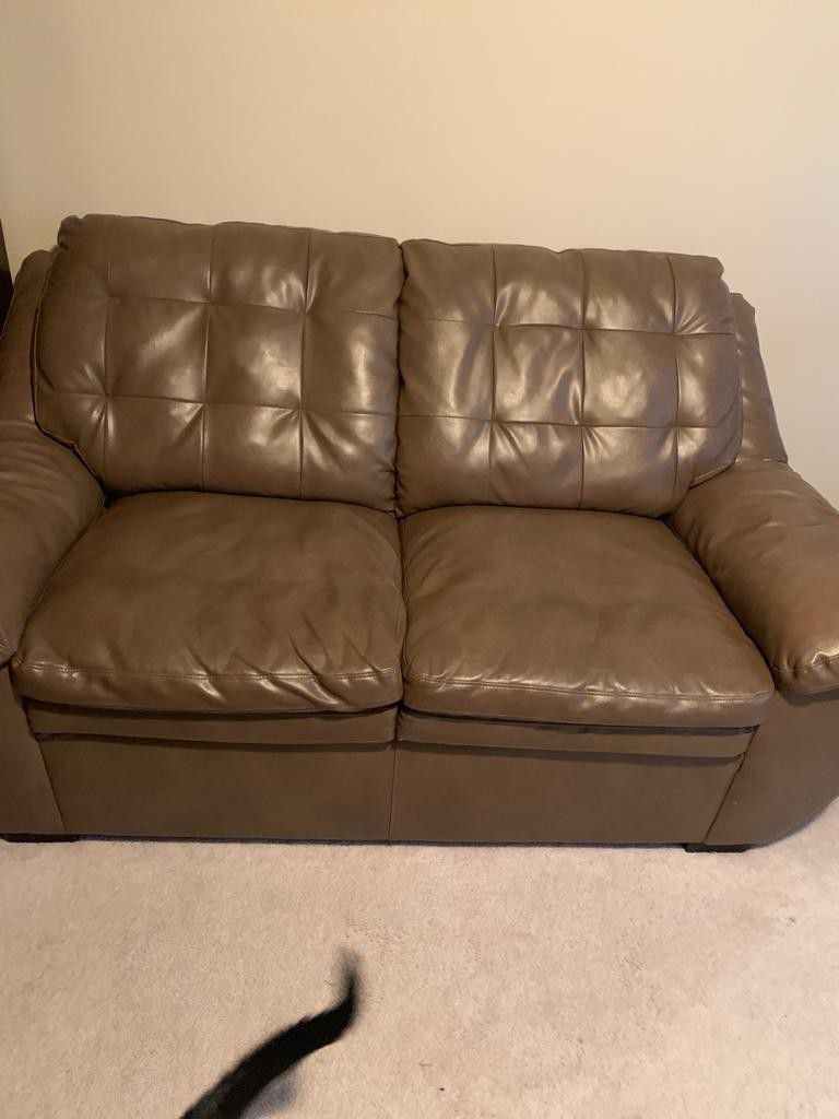 2 leather love seat couches