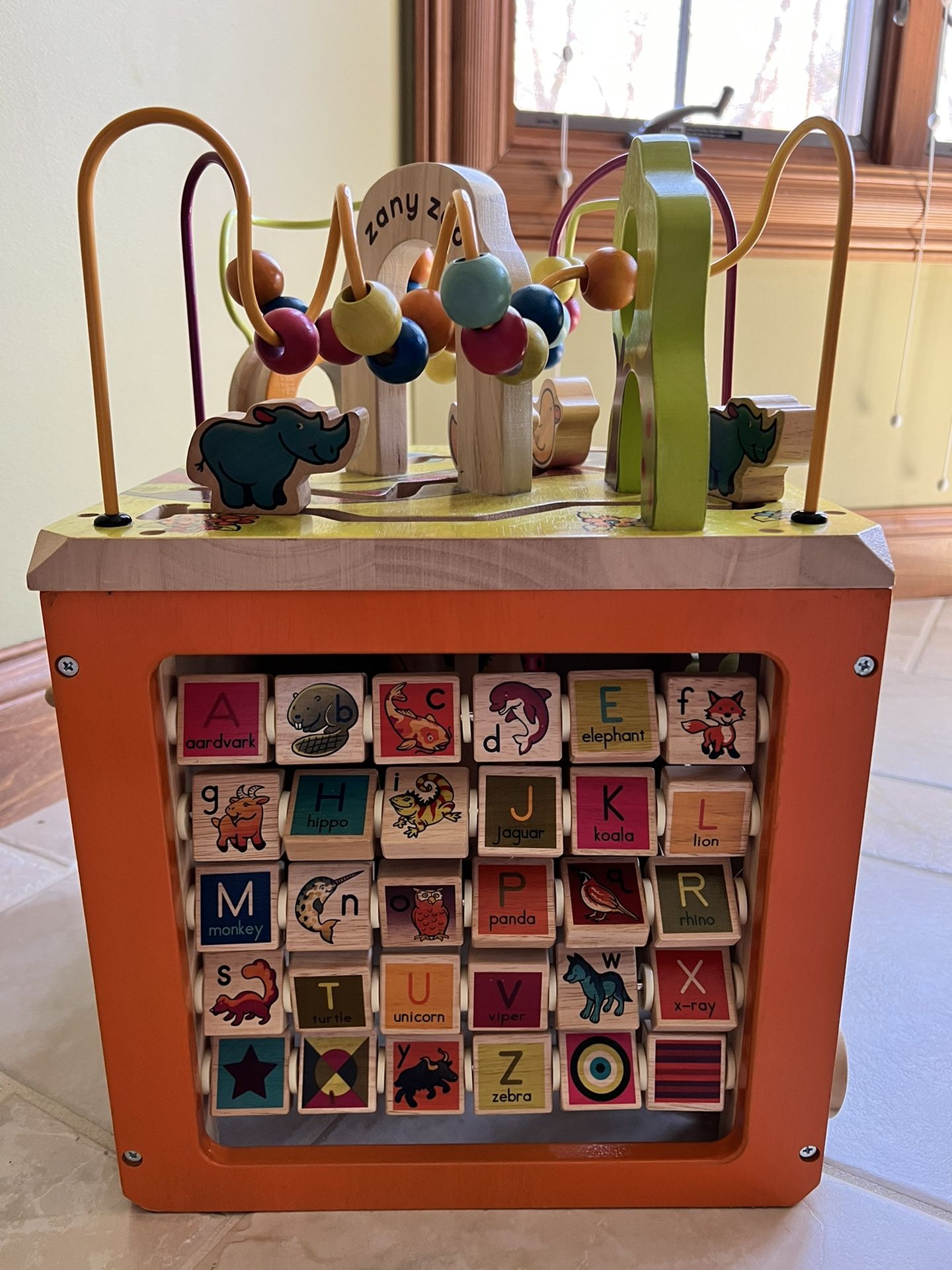 B. Toys Wooden Zany Zoo Activity Table