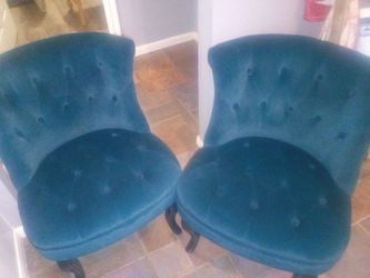 Two blue velvet chairs