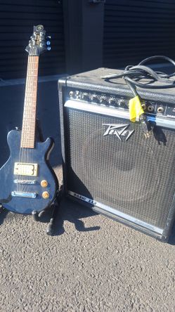 SMALL GUITAR FOR PRACTICE  WITH AMP.