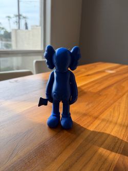 small KAWS figure