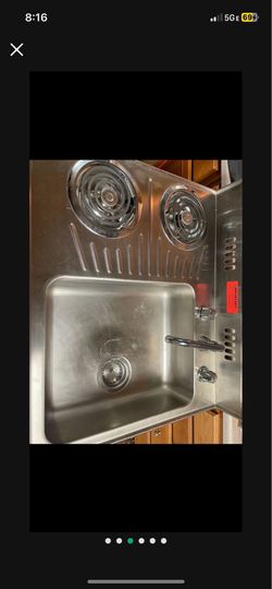 Sink stove and fridge all in one.