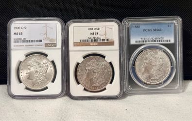 Lot of 3.  Graded Morgan silver dollars