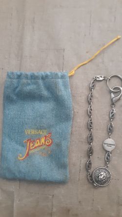 Chain in Versace Jean bag Gianni versace. On little coin other symbol is lion head