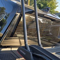 Rivian racks and 2 Yakima bike racks