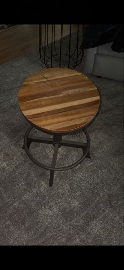 Set of two bar stools. Bar stools swivel and height adjust.