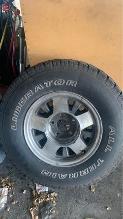 Factory GMC rim with tire