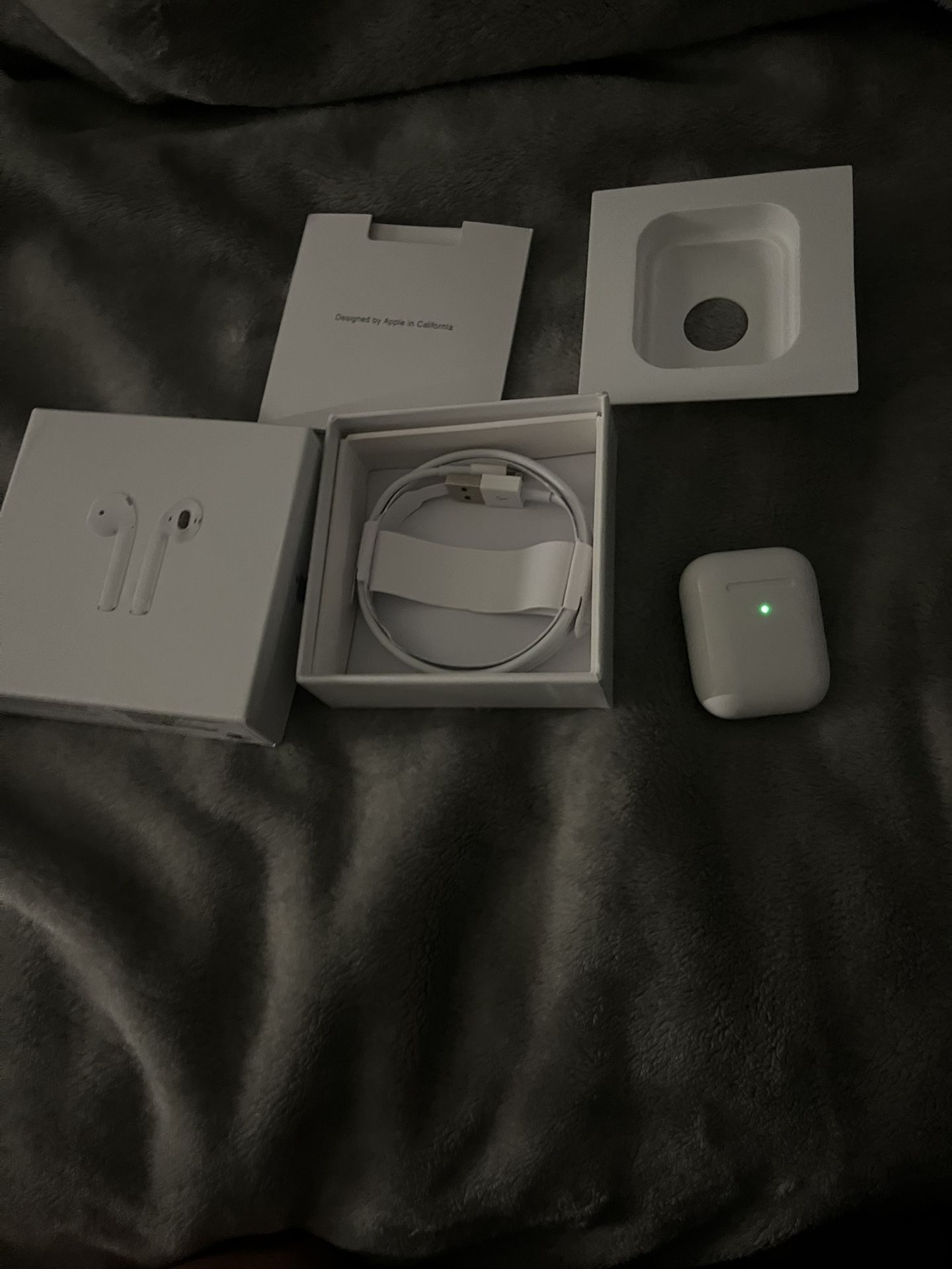 2nd Gen Airpods open box with everything in the box