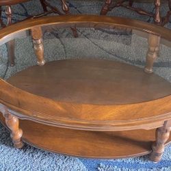  42” L x 28”W x 16”H glass/wood coffee table