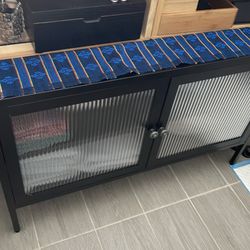 Metal cabinet with glass doors