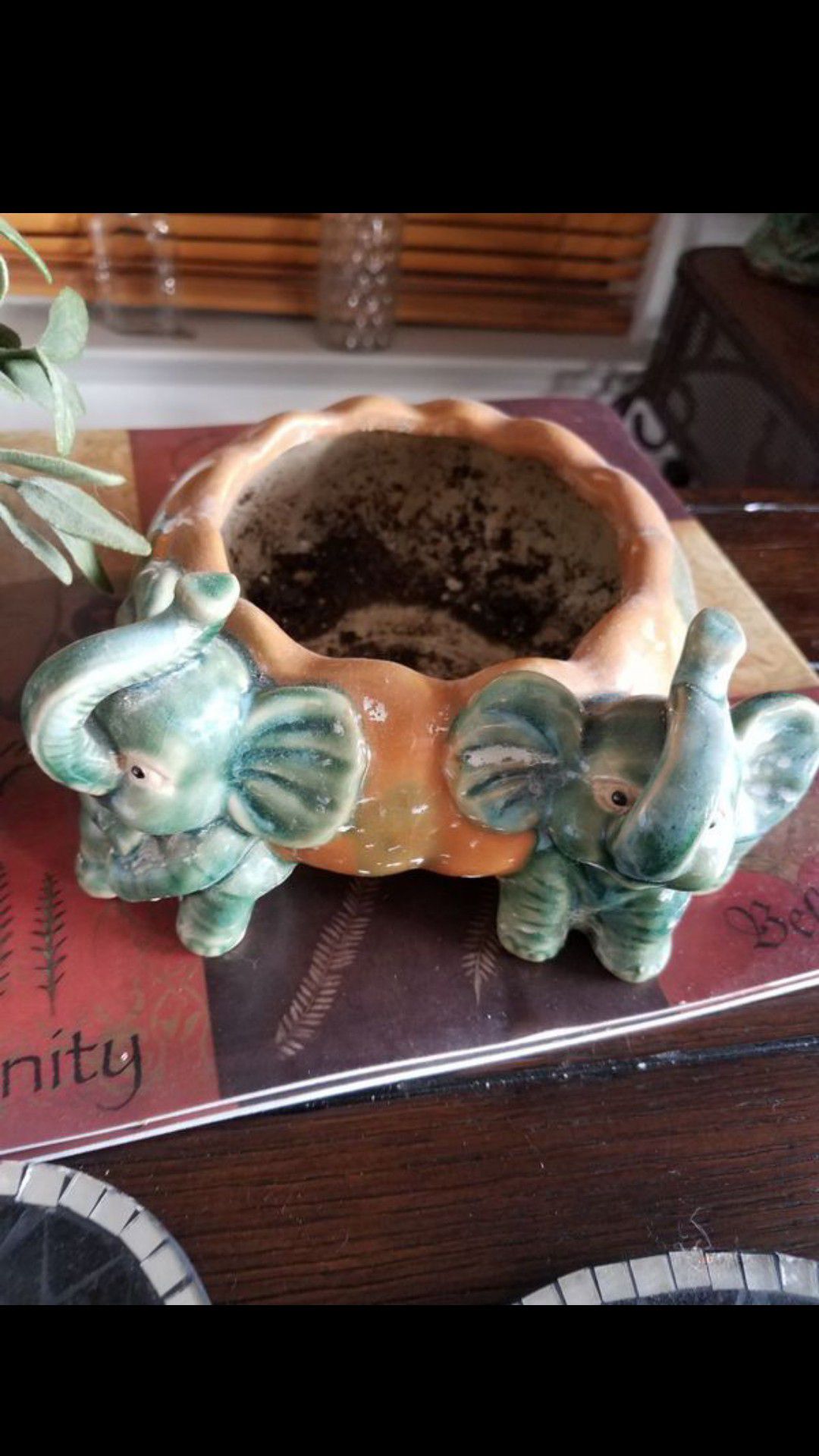 Elephant planter with fake plant. NORTH Fort Worth