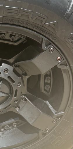 4 matching black off-road rims with tires 18 inches