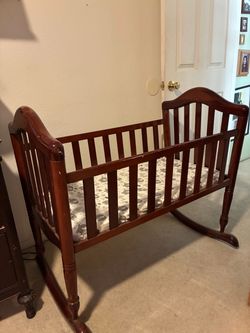 Brown wood bassinet!