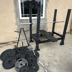 Ethos Bench press with 7ft bar plus 340lbs of Olympic weights and curl bar plus weights tree