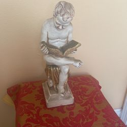 Jaru art pottery sitting child reading 