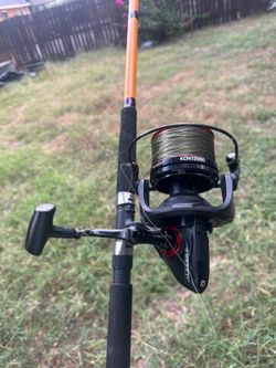 Spinning reel 12000 size on 10' surf rod 2 piece.