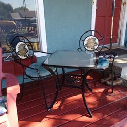 metal outdoor table with 2 chairs