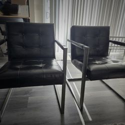 (2) Solid Metal Framed Black Leather Chairs