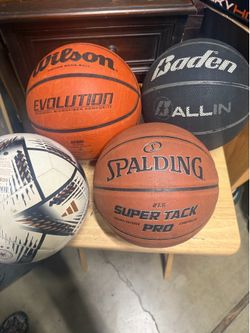 3 basket balls and one soccer ball