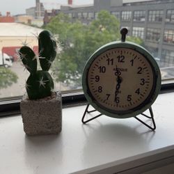 Small Clock And Artificial Cactus