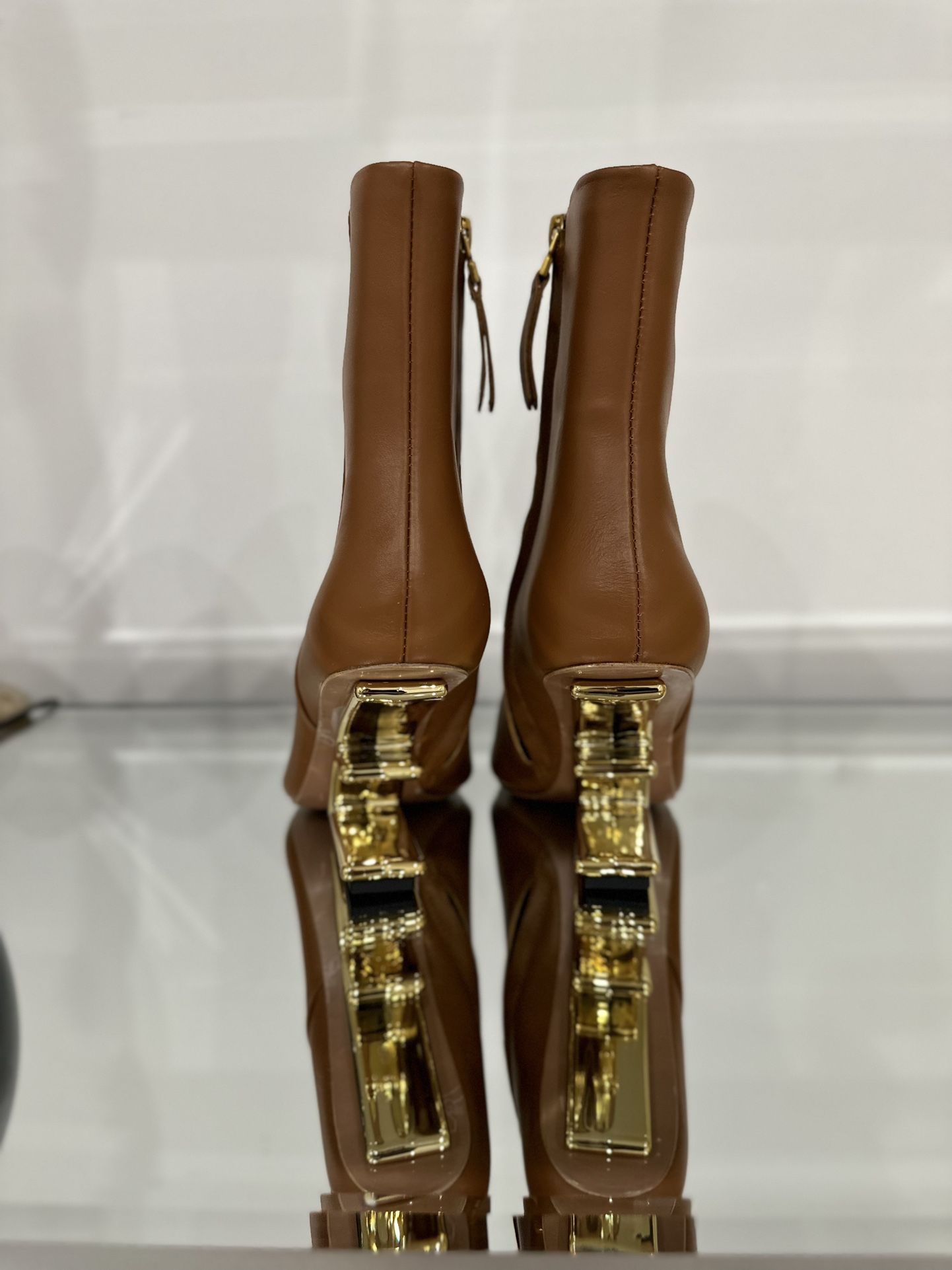 NEW SEASON FENDI FIRST F-SHAPED HEEL ANKLE BOOTS for Sale in  Fendi First/type Leather Ankle Boot with Sculpted Gold Heel. main image 1