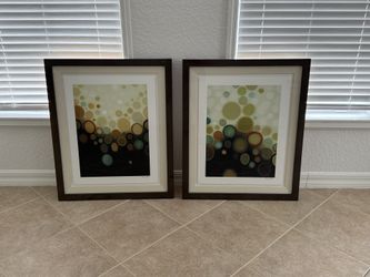 Two large framed art prints