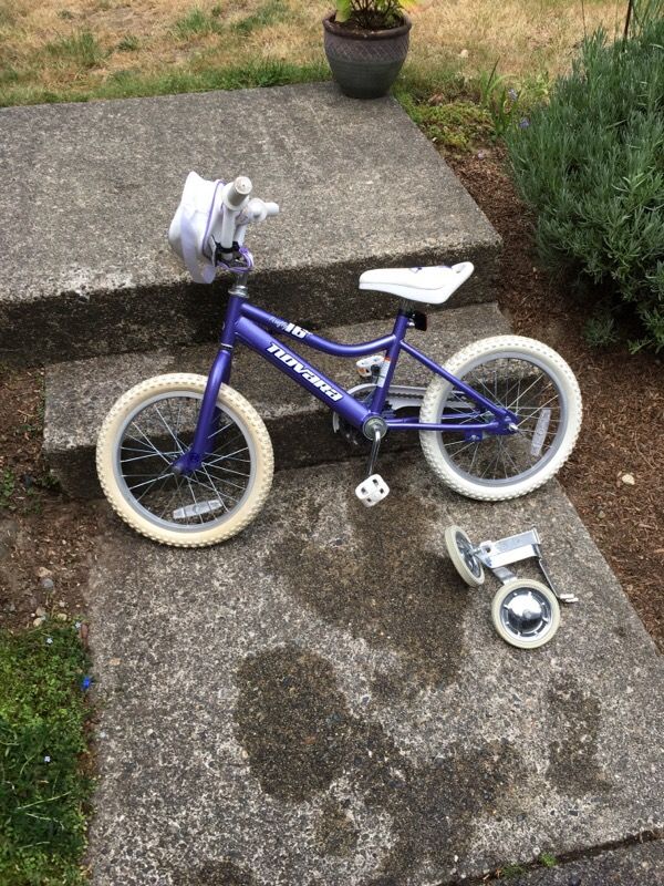 Novara Firefly 16 inch girls bike with training wheels.