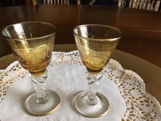 Gold with gold trim stemmed wine glasses